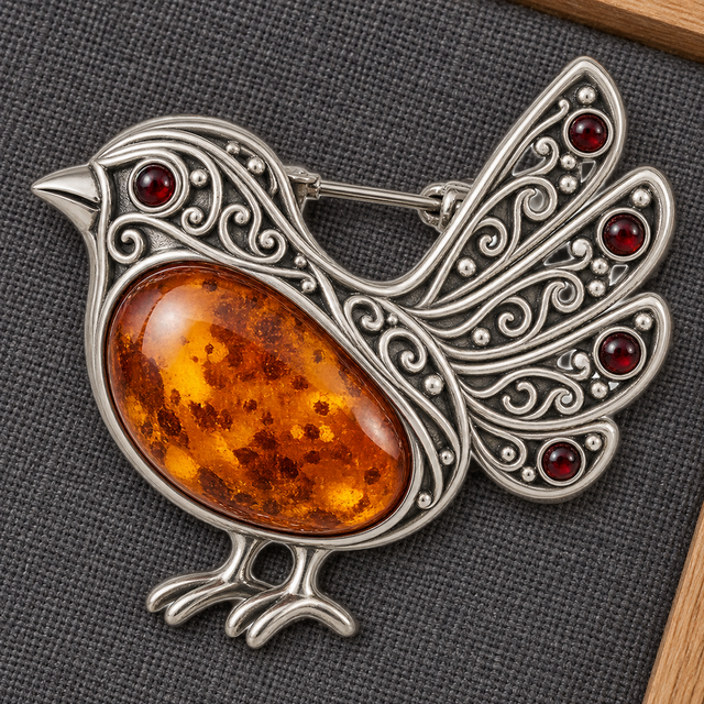 Amber bird brooch reference image